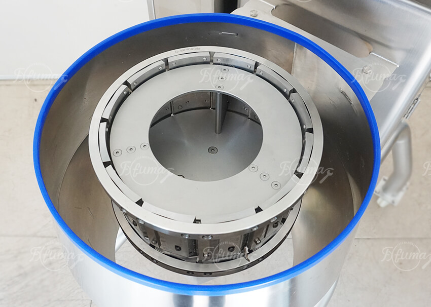 Technician replacing blades on a vegetable and fruit shredding machine safely