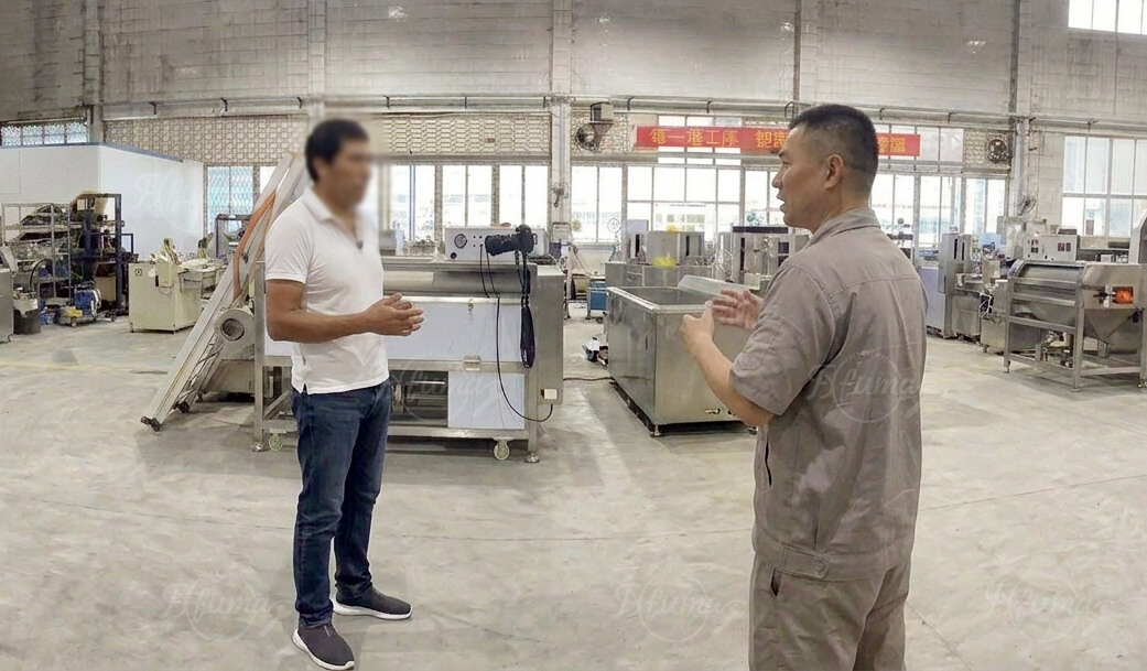 customer inspecting pumpkin processing machines on site